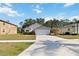 Inviting single-Gathering home with a two-car garage, neat landscaping, and a long driveway at 20335 Macon Pkwy, Orlando, FL 32833