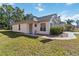 Attractive single-story home with a well-manicured lawn, arched windows, and a welcoming entrance at 20335 Macon Pkwy, Orlando, FL 32833