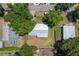 Aerial view of the property, highlighting the home's location, lot size, surrounding trees, and neighborhood at 219 Stribling Dr, Auburndale, FL 33823