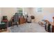 Bedroom with a desk, rolling chair, wood-look floors, a window, and gray-blue carpet at 219 Stribling Dr, Auburndale, FL 33823