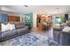 Spacious living room open to the kitchen with a view of the backyard, providing a comfortable and inviting atmosphere at 219 Stribling Dr, Auburndale, FL 33823