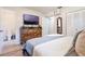 Bedroom featuring a dresser, a TV, two closets, and an ensuite bathroom with toilet at 219 Stribling Dr, Auburndale, FL 33823