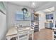 Charming dining area with white furnishings and decorative touches plus lots of light at 2329 Oak Park Way # 204, Orlando, FL 32822