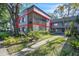 Attractive condo exterior with a screened patio in a lush landscaped setting at 2329 Oak Park Way # 204, Orlando, FL 32822
