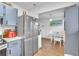 Kitchen featuring stainless steel refrigerator that harmoniously connects to the adjacent dining area at 2329 Oak Park Way # 204, Orlando, FL 32822