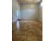 A large, open basement space with tiled flooring at 235 Crabtree Ave, Orlando, FL 32835