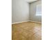 Tiled bedroom with window offering natural light at 235 Crabtree Ave, Orlando, FL 32835