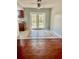 A dining area featuring hardwood floors and door access to the outside at 235 Crabtree Ave, Orlando, FL 32835