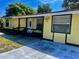Charming single-story home with a quaint front porch and well-maintained exterior at 235 Crabtree Ave, Orlando, FL 32835