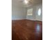 The living room has gray walls and hardwood floors at 235 Crabtree Ave, Orlando, FL 32835