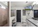 Luxurious bathroom featuring a shower with glass, vanity with a TV, and a toilet at 2683 Bobcat Chase Blvd, Oakland, FL 34787