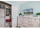Bedroom area offering ample storage and a television at 2683 Bobcat Chase Blvd, Oakland, FL 34787