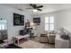 Upstairs room features neutral colors, ceiling fan, desk, and white shiplap accent wall at 2683 Bobcat Chase Blvd, Oakland, FL 34787