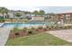A community pool surrounded by lounge chairs and fresh landscaping at 2683 Bobcat Chase Blvd, Oakland, FL 34787