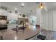 Well-lit kitchen with stainless steel appliances, a large island with bar seating, and an adjacent dining area at 2683 Bobcat Chase Blvd, Oakland, FL 34787