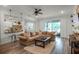 Bright and airy living room with a comfortable sectional sofa and sliding glass doors leading to the outdoor area at 2683 Bobcat Chase Blvd, Oakland, FL 34787