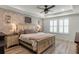 Main bedroom features a brick accent wall, and a ceiling fan at 2683 Bobcat Chase Blvd, Oakland, FL 34787