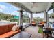 Inviting screened patio with comfortable seating, ceiling fan, and poolside views, perfect for relaxing and entertaining at 2683 Bobcat Chase Blvd, Oakland, FL 34787