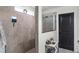 Modern shower features a rainfall shower head, glass door, and tiled walls at 2683 Bobcat Chase Blvd, Oakland, FL 34787