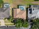 Birds eye view shows in-ground pool with screened enclosure, mature landscaping, and the neighborhood street at 2780 Highland View Cir, Clermont, FL 34711
