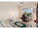 Bedroom with neutral walls, ceiling fan, and a carpet with a floral design at 2780 Highland View Cir, Clermont, FL 34711