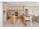 Well-lit kitchen boasts ample wood cabinetry, stainless steel appliances, and a convenient island at 2780 Highland View Cir, Clermont, FL 34711