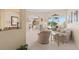 Bright living room featuring neutral decor, arched doorways, and views of the pool at 2780 Highland View Cir, Clermont, FL 34711