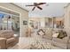 Spacious living room with an open floor plan and access to outdoor patio and kitchen at 2780 Highland View Cir, Clermont, FL 34711