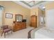 Comfortable main bedroom features tray ceiling and en-suite bathroom at 2780 Highland View Cir, Clermont, FL 34711