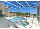 Beautiful in-ground pool and hot tub with screened-in enclosure, golf course and treeline views at 2780 Highland View Cir, Clermont, FL 34711