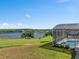 An oversized pool in a screened enclosure, overlooking a golf course at 2780 Highland View Cir, Clermont, FL 34711