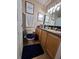 Cozy bathroom features modern decor, vanity and framed artwork at 2979 Cool Breeze Cir, St Cloud, FL 34769