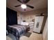 Bedroom with a fan, carpet flooring and closet with white doors at 2979 Cool Breeze Cir, St Cloud, FL 34769