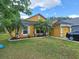 Charming single-Gathering home with a lush green lawn and well-manicured landscaping at 2979 Cool Breeze Cir, St Cloud, FL 34769