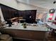 Well-lit kitchen and dining area with granite counters and stainless steel appliances at 2979 Cool Breeze Cir, St Cloud, FL 34769