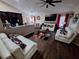 Spacious living room features sleek hardwood floors and contemporary decor at 2979 Cool Breeze Cir, St Cloud, FL 34769