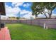 Picture of the spacious fenced in backyard of the property with an air conditioning unit at 3103 Yorych Ln, Orlando, FL 32822