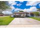 Charming single-story home with a well-maintained lawn and a quaint front garden at 3103 Yorych Ln, Orlando, FL 32822