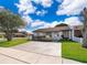 Charming single-story home with a well-maintained lawn and a quaint front garden at 3103 Yorych Ln, Orlando, FL 32822