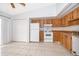 Bright kitchen showcasing tile floors, ample cabinet space, and classic appliances at 3103 Yorych Ln, Orlando, FL 32822