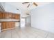Open-concept living space with tile flooring adjacent to the kitchen area at 3103 Yorych Ln, Orlando, FL 32822
