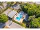Aerial view of the community pool, clubhouse, tennis courts and playground at 3103 Yorych Ln, Orlando, FL 32822