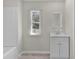 Bright bathroom features a modern vanity and a window that allows for plenty of natural light at 33506 Luana Ct, Leesburg, FL 34788