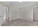 Bedroom featuring wood-look flooring and open doorways, providing seamless transitions throughout the home at 33506 Luana Ct, Leesburg, FL 34788