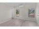 Cozy bedroom with wood-look flooring and a mini split system, providing comfort and style at 33506 Luana Ct, Leesburg, FL 34788