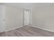 Bedroom boasting wood-look flooring and multiple doorways for easy access to other areas of the home at 33506 Luana Ct, Leesburg, FL 34788