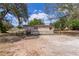 Charming single-story home featuring well-maintained yard, fenced perimeter, and inviting front entrance with wood stairs at 33506 Luana Ct, Leesburg, FL 34788