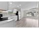 Modern kitchen with stainless steel appliances and white cabinets, ample counter space, and recessed lighting at 33506 Luana Ct, Leesburg, FL 34788