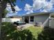 Expansive backyard with a patio, comfortable seating, and a well-maintained lawn at 3420 Gerber Daisy Ln, Oviedo, FL 32766