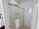 This bathroom features a glass-enclosed shower with white tile surround and soft natural light at 3420 Gerber Daisy Ln, Oviedo, FL 32766
